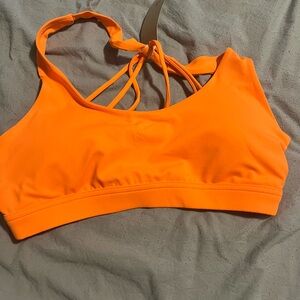 Vibrant Orange Sports Bra with Strappy Back Design